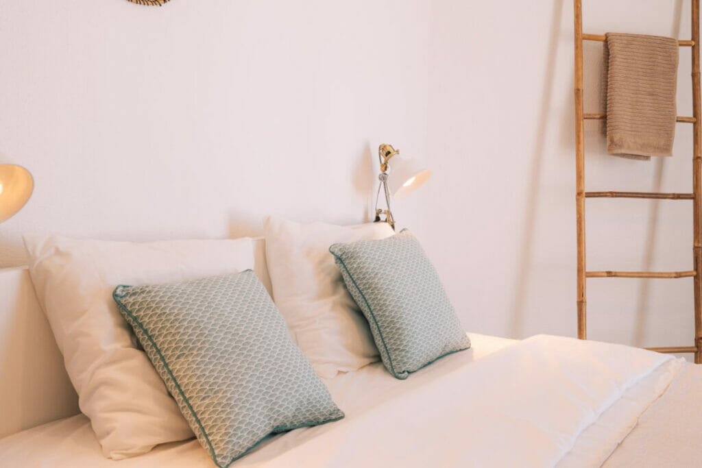 Made bed in room in Ericeira