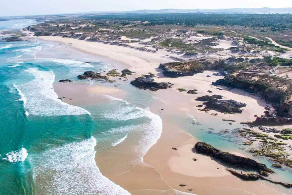 View of land with sea and beach