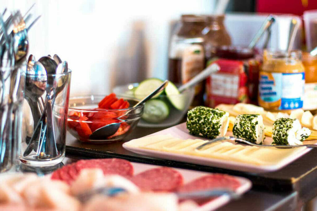 Breakfast buffet with cheese, sausage and vegetables